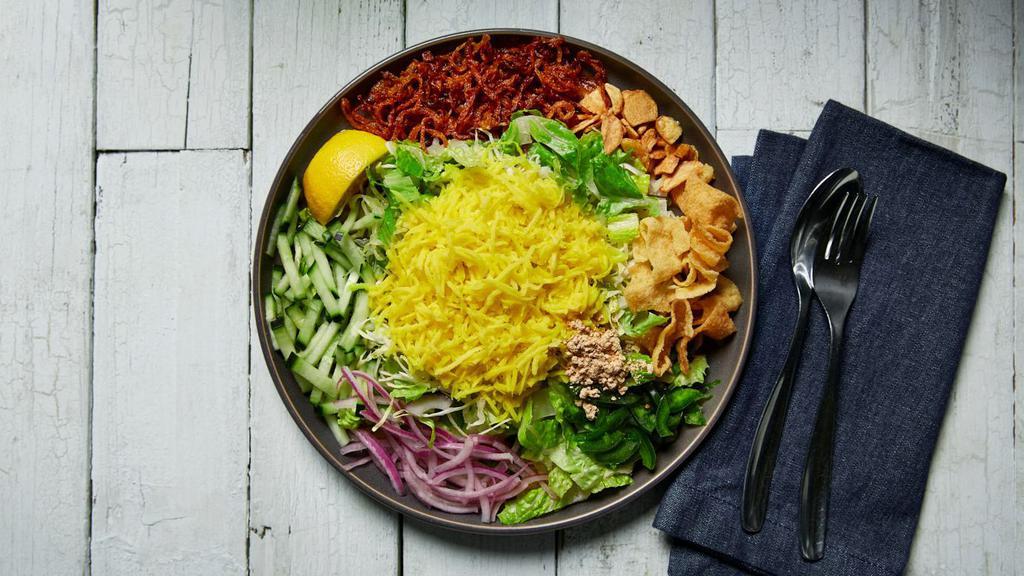 Mango Salad · Vegan, gluten-free. This delicious sweet and tart salad with pickled mango is tossed with cabbage, lettuce, fried onions, and fresh sliced cucumbers.