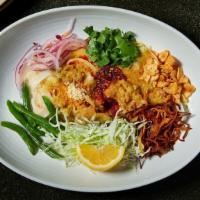 Shan Noodles · Gluten-free. Rice noodles in a spicy tomato sauce with pickled radish, cilantro, peanuts, an...