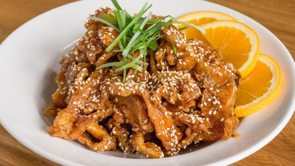 Sesame Chicken · Lightly battered and fried chicken breast cooked with a sweet and tangy sauce. Topped with sesame seeds.