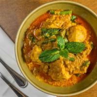 Coconut Chicken Curry · Gluten-free. Chicken thighs simmered in an aromatic stew of coconut milk, turmeric, Thai bas...