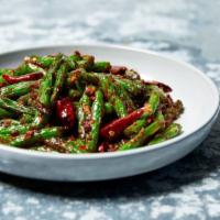 Dry-Fried String Beans · Vegan. Sichuan-style string beans wok-tossed with mangoes, onions, oyster sauce, Thai basil ...