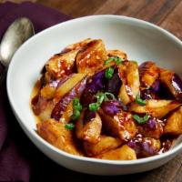 Eggplant with Garlic Sauce · Gluten-free, vegan. Tender eggplant sautéed with a garlic and chili sauce. Topped with scall...