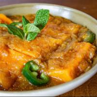 Yellow Bean Tofu Curry · Burmese style red curry made with our homemade yellow bean tofu, pickled mangoes and jalapeñ...