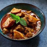 Pork Curry with Potatoes · Tender pork curry slow-cooked with pickled mangoes, potatoes, onions, garlic, ginger, turmer...