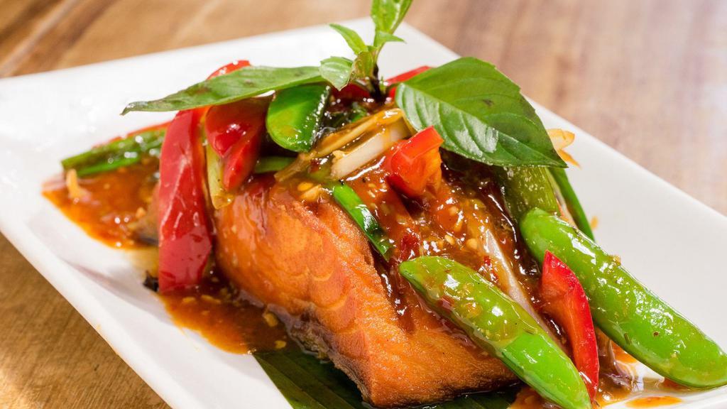 Lemongrass Salmon · Gluten-free. Fried salmon topped with Thai basil, chili, lemongrass, snap peas, and bell peppers.