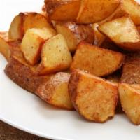 House Potatoes · Cooked Red potatoes with bell peppers and onions, served with ketchup.