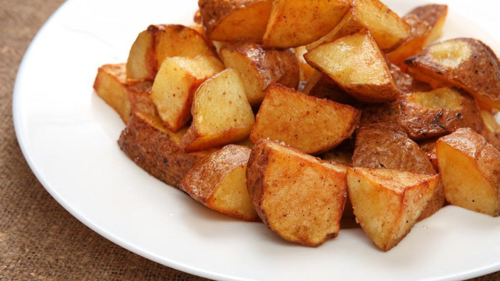 House Potatoes · Cooked Red potatoes with bell peppers and onions, served with ketchup.