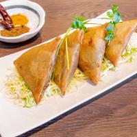 Vegetarian Samosas (4 Pc) · Vegetarian. Flour wrap with potatoes and onions, carrots, peas mixed with Burmese spices. (C...