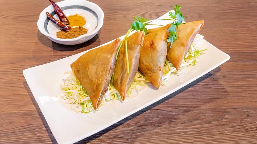 Samosas · Vegetarian. Wheat flour wrap with potatoes and peas mixed with Burmese spices. (4 pcs)