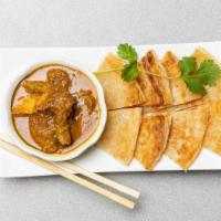 Palatha with side dipping curry · Pan-fried roti bread served with side of dipping curry sauce. (Cannot be made vegan or glute...