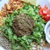 Tea Leaf Salad · Burmese fermented tea leaves with peanuts, sesame seeds, sunflower seeds, garlic chips, frie...