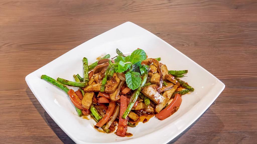 Fiery Tofu · Wok stir fried with tofu, red bell peppers, garlic, chili, ginger, string beans and soy sauce.