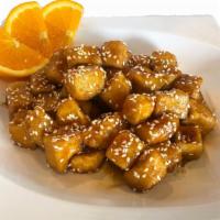 Sesame Tofu · Cubed soft tofu tossed with house honey soy sauce and topped with sesame seeds