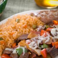 Alambre · Carne asada with bacon, ham, cheese, bell peppers, and onions served with rice, beans, and t...