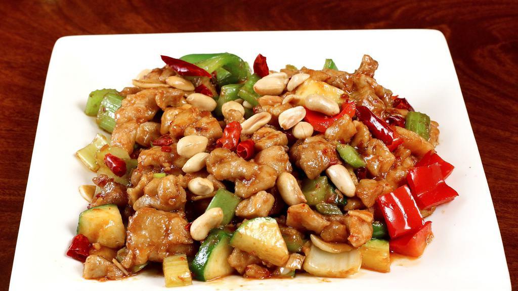 B10. Kung Pao Chicken · Diced chicken with water chestnut celery zucchini and green pepper stir fried in spicy brown sauce with peanut.