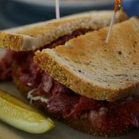 Gunther's Famous Reuben · The best of all worlds! Corned beef, pastrami, housemade sauerkraut, melted swiss on toasted...