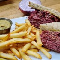 Hot Corned Beef · Brined for optimum flavor, boiled for tenderness oven roasted because we said so. Sliced thin.