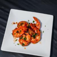 Lemon Pepper Shrimp · Juicy shrimp marinated in a sweet and spicy herb butter blend of lemon and chili before bein...
