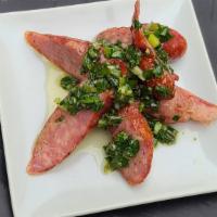 Polish Sausage · Tender and juicy house-made Polish Sausage topped with a refreshing Chimichurri.