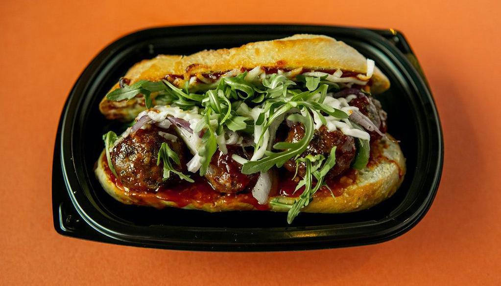 Classic Bbq Meatball Sandwich · Beef, veal, pork & ricotta meatballs tossed with sweet and tangy BBQ sauce, melted mozzarella, sautéed onions and peppers, arugula, served on toasted bread.