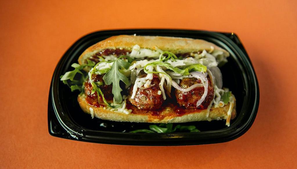 Korean Meatball Sandwich · Beef, veal, pork & ricotta meatballs tossed with spicy, sweet Korean BBQ glaze, melted mozzarella, sautéed onions and peppers, arugula, served on toasted bread.