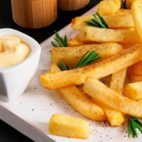 French Fries · Fresh batch of French fries with a soft interior and a crunchy exterior.