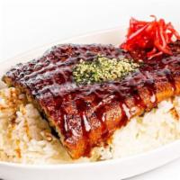 Unagi Don · Grilled whole unagi fillet served over a bed of rice with unagi sauce and side Japanese salad.