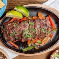 Steak Fajitas · served w/ rice and choice of beans, pico de gallo, guacamole and 3 tortillas