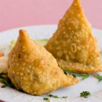 Vegetable Samosas (2 Pieces) · Homemade pastry stuffed with seasoned potatoes and peas.
