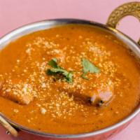 Chicken Tikka Masala · Chicken cooked in mild creamy curry sauce with a touch of ground cashew.