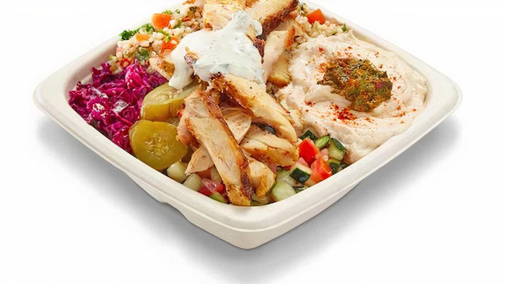 All Natural Chicken Shawarma Bowl · Our grilled chicken shawarma is all natural without any added hormones.

It’s marinated for 24 hours so it’s succulent and flavorful.