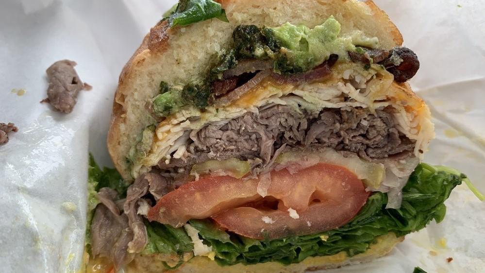 Beast Mode · Roast beef, turkey, smoked gouda cheese, avocado & pesto sauce . Served with mayo, mustard, lettuce, onions, tomatoes, pickles & sprouts.