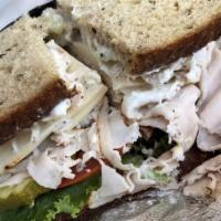 Birdhouse Sandwich · Turkey, monterey jack and chicken salad. Served with mayo, mustard, lettuce, onions, tomatoe...