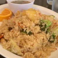 32. Pineapple Fried Rice · Pan fried rice with egg, pineapple, chicken, prawns, yellow onions, raisins, and cashew nuts.