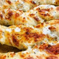 Breadsticks · 8 ct with cheese and garlic w/ seasoning.