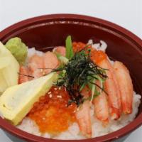 Kani Chirashi  · Crab and  salmon roe over sushi rice topped with green onion and sesame seeds (Due to curren...