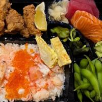 Kani Chirashi Bento  · Crab and salmon roe over sushi rice, fried boneless chicken, sashimi, edamame and pickles. (...