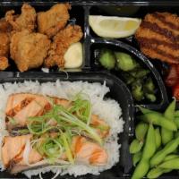 Salmon Shioyaki Bento  · Grilled salted salmon over rice, fried boneless chicken, clam chowder croquette, and edamame