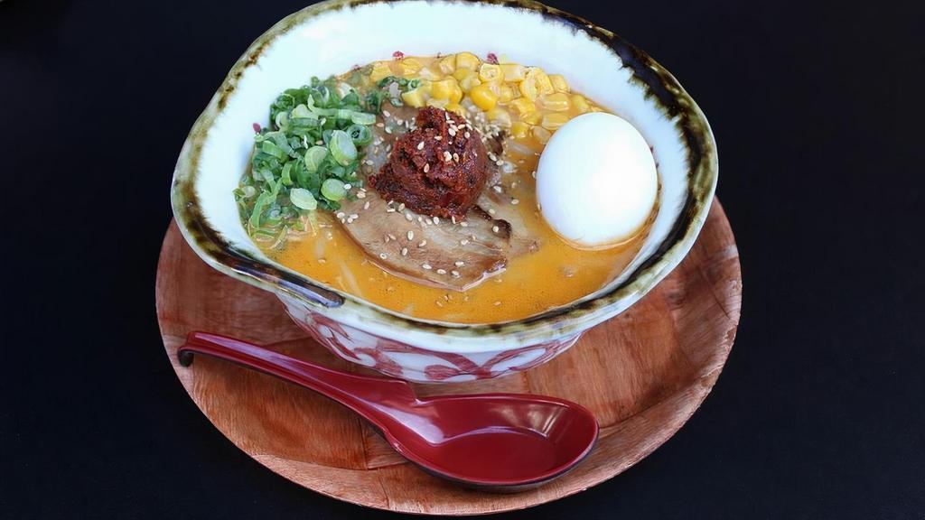 SPICY MISO RAMEN · Miso ramen with chicken broth topped with original spicy paste.. Medium thick curly noodles, chicken broth, smoked chashu pork, spicy miso ball, bean sprouts, green onion, corn, sesame seeds and seasoned boiled egg.