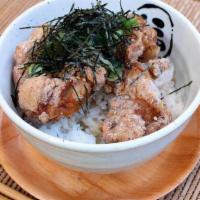 Karaage Bowl · Japanese style fried chicken over rice. Green onion, sesame seeds and nori seaweed.