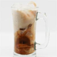 Iced Chai Latte · Organic nine spice chai with steamed milk and coconut sugar served over ice