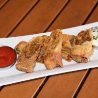 Philly Cheesesteak Spring Rolls · Spiced steak, provolone & American cheeses, horseradish cream sauce, house spicy ketchup