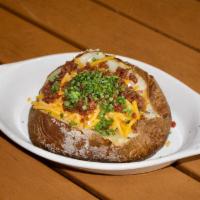 Loaded Baked Potato · Ultimate loaded baked potato. Whipped butter, applewood smoked bacon, chives, sour cream, . ...