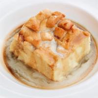 Warm Bread Pudding · Maple brandy sauce & creme anglaise