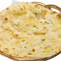 Onion Naan · Fresh bread baked in clay oven with onions.