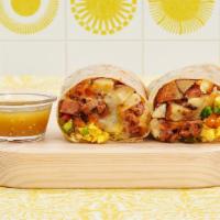 Build Your Own Burrito · Two scrambled eggs with pico de gallo, your choice of meat and toppings wrapped in a fresh t...