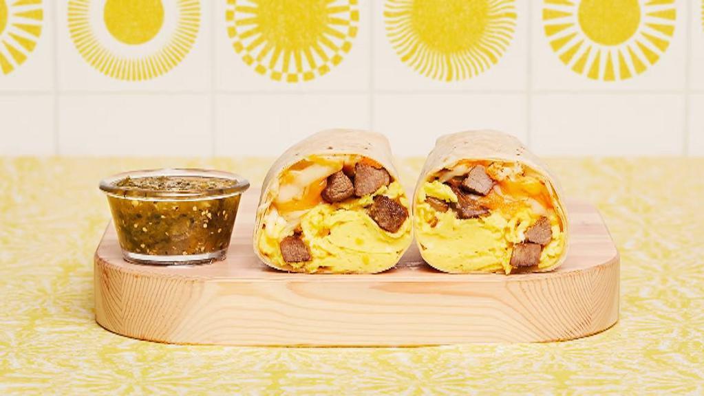 Steak Breakfast Burrito · Two scrambled eggs, breakfast potatoes, grilled steak, and melted cheese wrapped in a fresh flour tortilla.