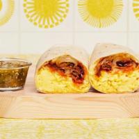 Bacon Bbq Breakfast Burrito · Two scrambled eggs, Mini Hash Browns, crispy bacon, BBQ sauce, grilled onions, and melted ch...