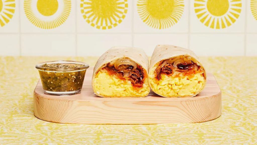 Bacon BBQ Breakfast Burrito · Two scrambled eggs, breakfast potatoes, crispy bacon, BBQ sauce, grilled onions, pico de gallo, and melted cheese wrapped in a fresh flour tortilla.