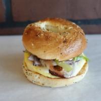 Breakfast Bagel · Choice of bagel with Egg and bacon or sausage.